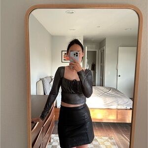 Silver metallic long sleeve top with a ruched front, perfect for a night out